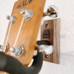 The Sunrise Shack stand on the wall helps to display one of our all time favorite instruments, the ukulele, adding a touch of charm and personality to the space