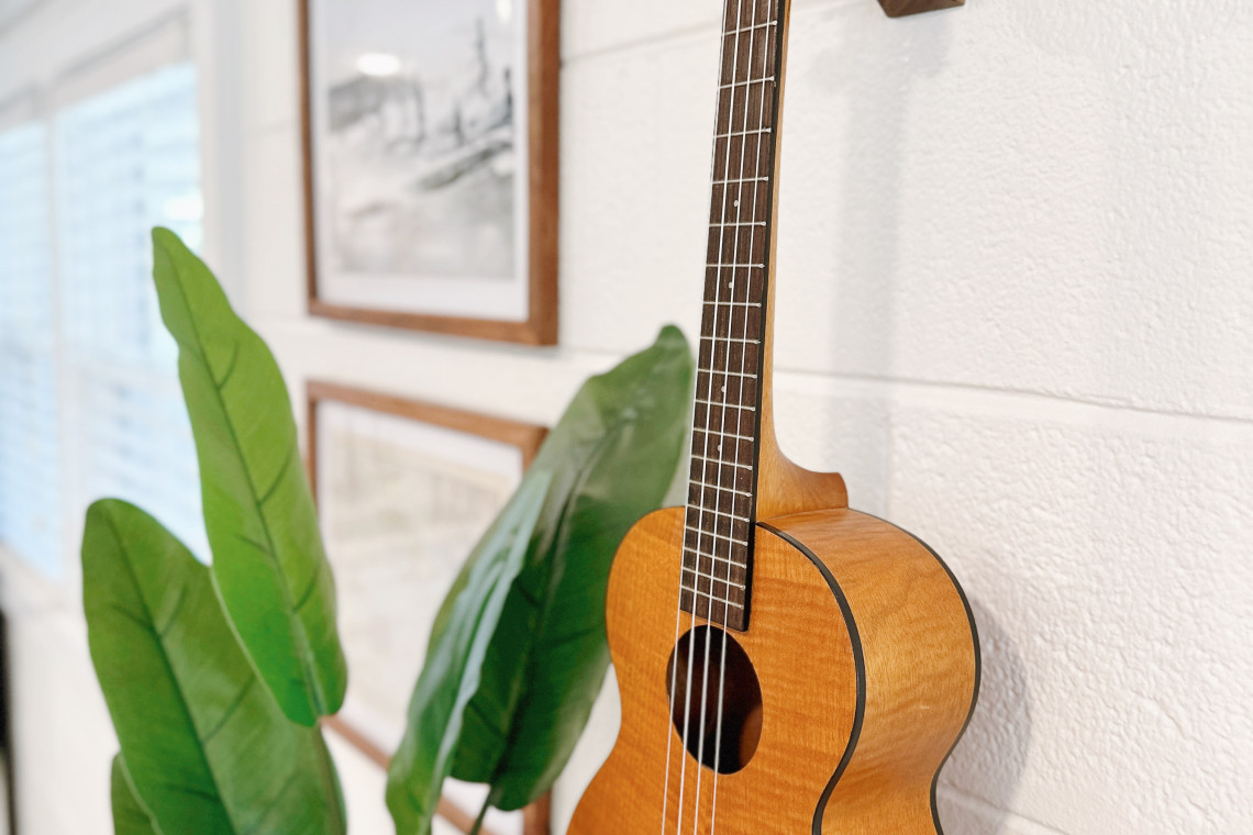 The ukulele is an iconic symbol of Hawaiian culture, representing the islands' rich history and traditions through its distinctive sound and the artful craftsmanship of its design